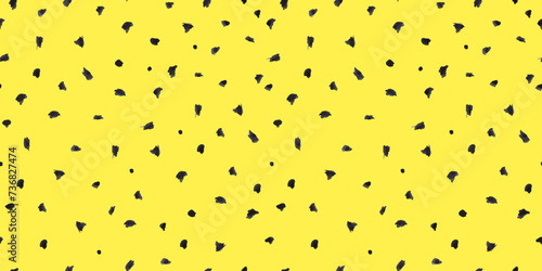 Dash pattern on yellow background. Wrapping paper with small black dots painted with a brush. Seamless simple minimal ornament. Abstract geometric grunge vector texture painted by ink.