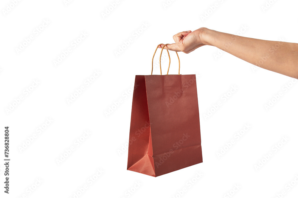 Red paper shopping bag in hand on transparent background.