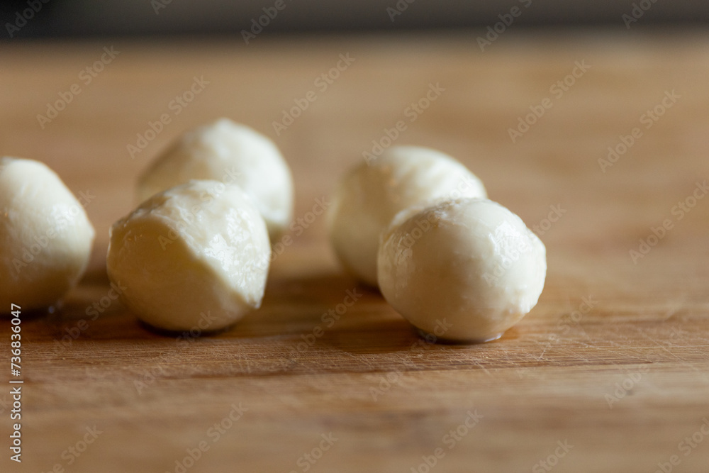 mozzarella balls close-up on wooden board mozzarella balls close-up on wooden board