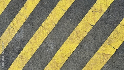 Top view of yellow stripes sign on the asphalt as warning sign for pedestrian crossing photo
