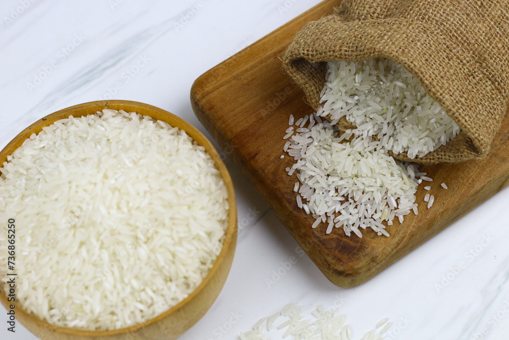 Beras or white rice, Indonesian main food made from Oryza sativa grain. Selective focus, Islamic theme for zakat, ramadan, eid Mubarak background. Copy space for text. Beras or white rice, Indonesian main food made from Oryza sativa grain. Selective focus, Islamic theme for zakat, ramadan, eid Mubarak background. Copy space for text.