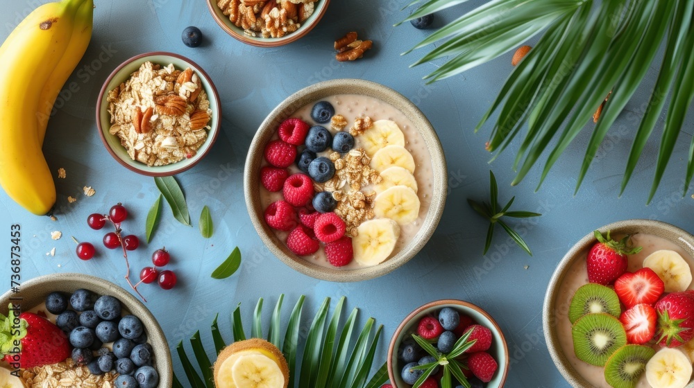 a table topped with bowls of food next to bananas, strawberries, blueberries, and kiwis. a table topped with bowls of food next to bananas, strawberries, blueberries, and kiwis.