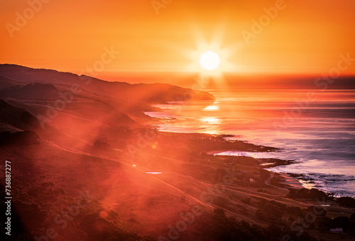 The view of the sunrise from the ocean from the Marriner's lookout in the Great Ocean Road photo