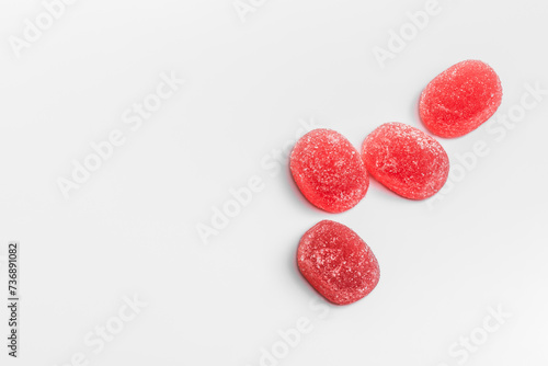 Four delicious raspberry gummy candies on a white background.Swedish candies. photo