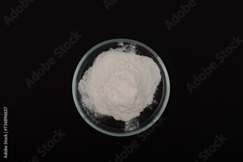 Sodium Carboxymethyl Cellulose, NaCMC in Petri dish. Food additive E466. Carboxymethylcellulose, carmellose, or croscarmellose powder. Stabiliser and Thickener photo