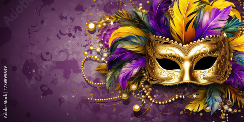 Carnival mask with colorful feathers on abstract blurred background.