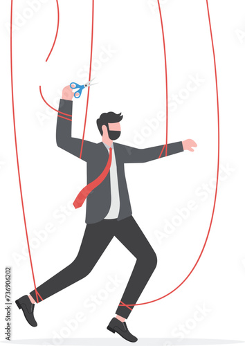 Freedom for work and decision making, authority to work independently, stop micromanagement, or people manipulation concept, businessman marionette, puppeteer use scissors to cut controlled strings.

