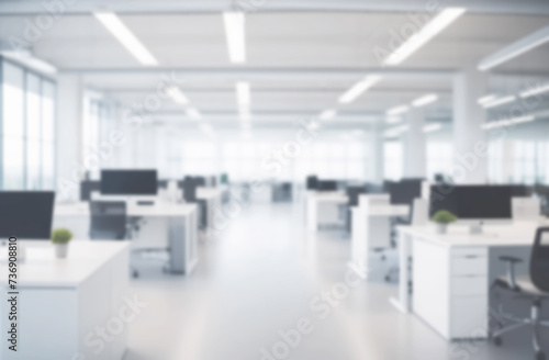 Blurred empty modern office. Defocused abstract light bokeh business eco open space interior background design. Corporate strategy, finance, operations, marketing. Tables with computers blur focus © Marina Demidiuk