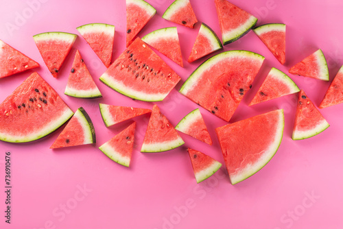 Sliced watermelons on pink background