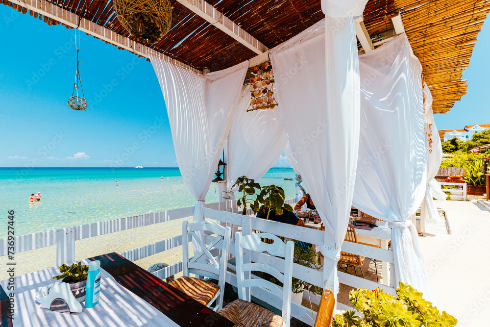 Paradise restaurant on tropical seashore. Zakhyntos, Greece.