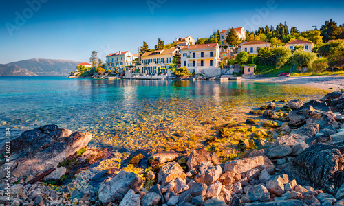Splendid summer cityscape of Fiskardo town with Zavalata Beach. Attractive morning seascape of Ionian Sea. Spectacular outdoor scene of Kefalonia island, Greece, Europe. Traveling concept background.