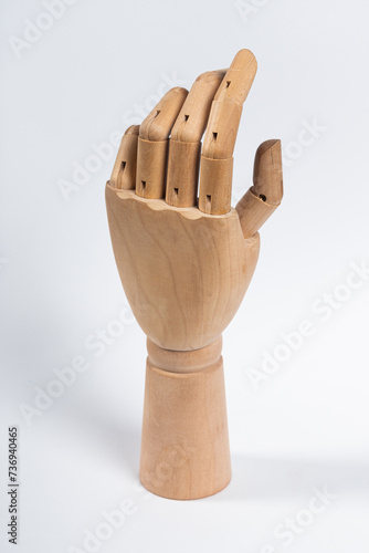 The wooden arm of a mannequin.