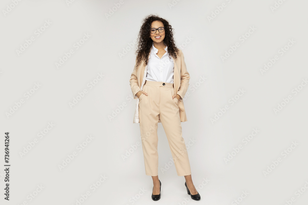 Attractive businesswoman in a suit on a light background Attractive businesswoman in a suit on a light background