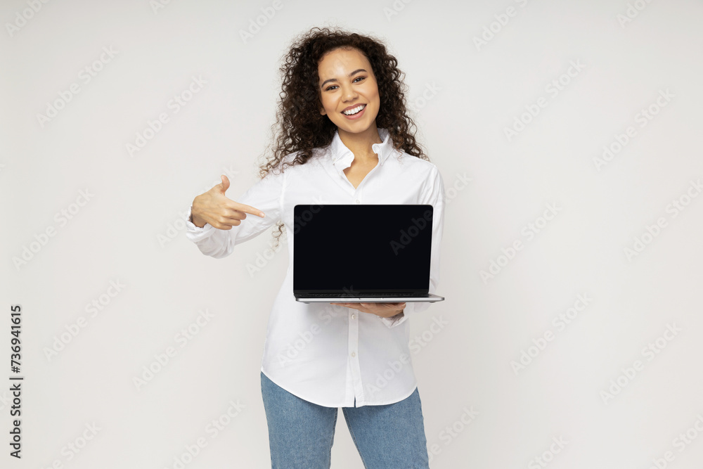 Young attractive girl with laptop in hands Young attractive girl with laptop in hands
