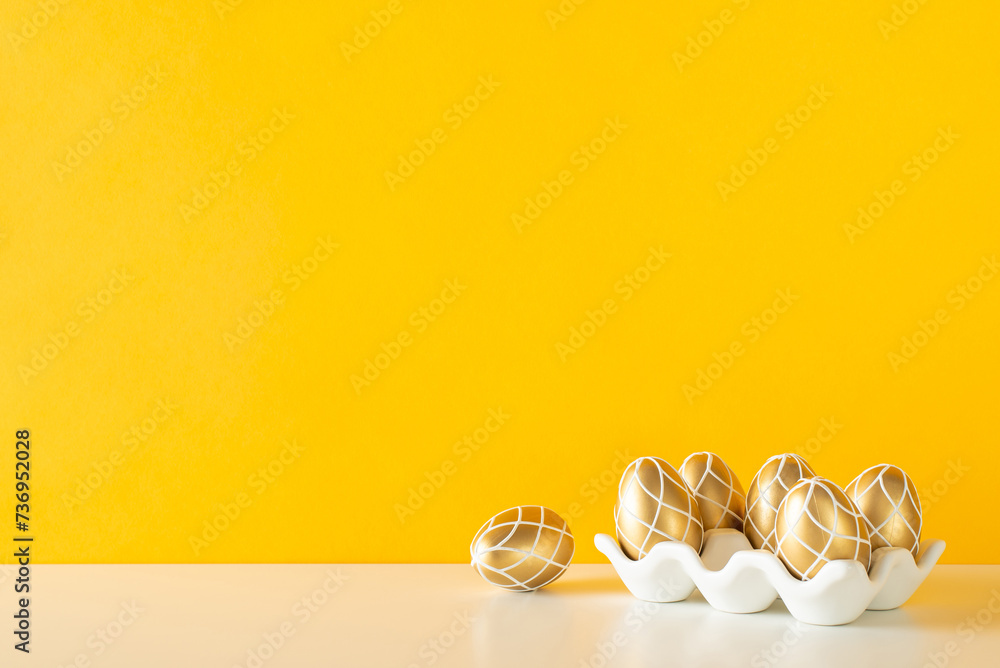 Modern Easter kitchen scene, showcasing side view table adorned with a sleek ceramic holder for shimmering golden eggs against a vivid yellow backdrop, ideal for text Modern Easter kitchen scene, showcasing side view table adorned with a sleek ceramic holder for shimmering golden eggs against a vivid yellow backdrop, ideal for text