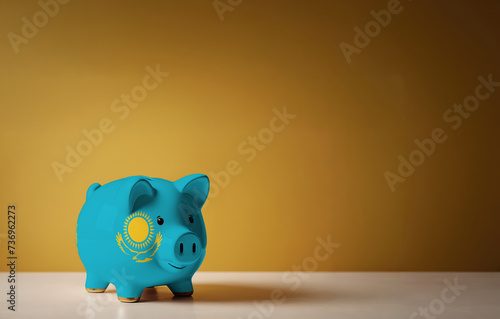 Piggy bank with painting of Kazakhstan flag. The problem is in the economy. Economic crisis. Saving money concept.