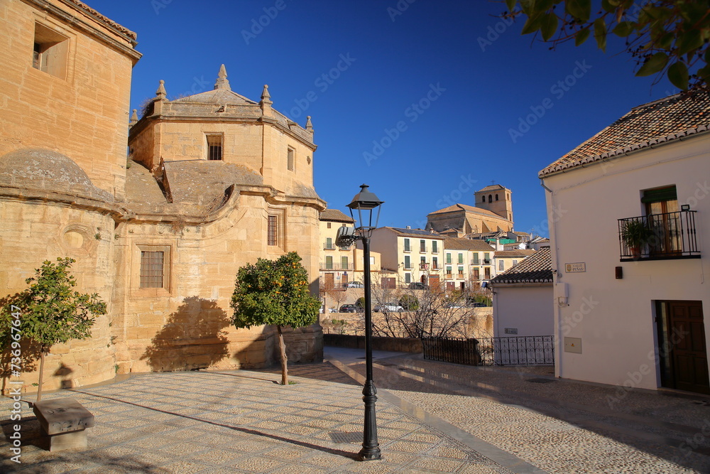 The external facade of Carmen church (on the left) in Alhama de Granada, Granada province, Andalusia, Spain, with the church of Incarnation in the background