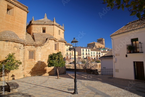 The external facade of Carmen church (on the left) in Alhama de Granada, Granada province, Andalusia, Spain, with the church of Incarnation in the background photo