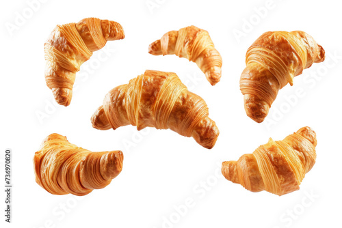Croissants that fresh and delicious falling in the air isolated on background, Breakfast time, popular plain croissant breads. photo