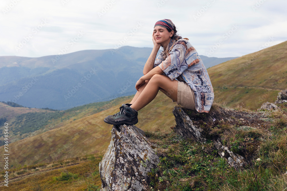 girl tourist on the background of a mountain landscape girl tourist on the background of a mountain landscape