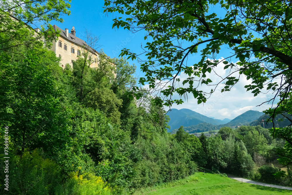 Panoramic view of medieval castle Rabenstein on a hill in Frohnleiten, Murtal, Styria (Steiermark), Austria. Travel destination sunny day in summer. Surrounded by idyllic forest in foothills of Alps