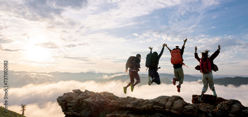 Group of happy hiker jumping on the hill © pakorn