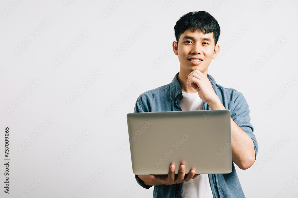 Portrait of a pensive young man, holding a laptop, finger on chin, deep in thought, contemplating questions with a curious gaze. Studio shot isolated on white, where inspiration meets technology. Portrait of a pensive young man, holding a laptop, finger on chin, deep in thought, contemplating questions with a curious gaze. Studio shot isolated on white, where inspiration meets technology.