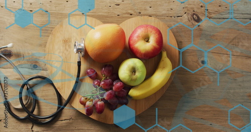 Image of chemical structures over stethoscope and fruit