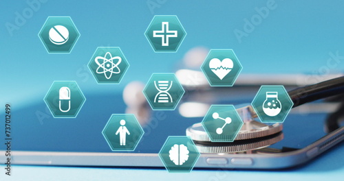 Image of medical icons over tablet and stethoscope