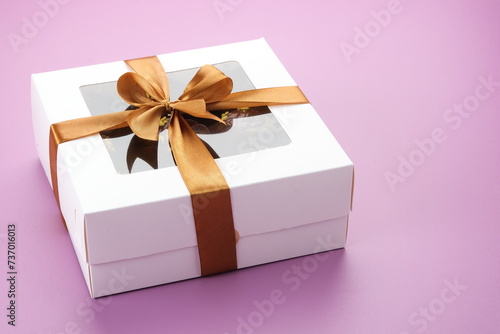 Chocolate cake in box. Gifts festive food love concept. 