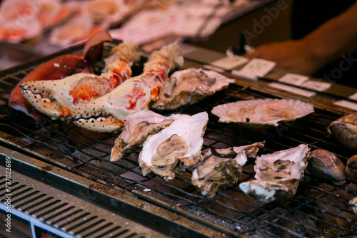 Photos Seafood at a food stall at the Tsukiji Outer Market in the city of Tokyo, Japan