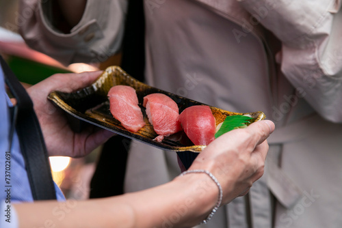 Photography Tuna nigiris at a food stall at the Tsukiji Outer Market in the city of Tokyo in Japan