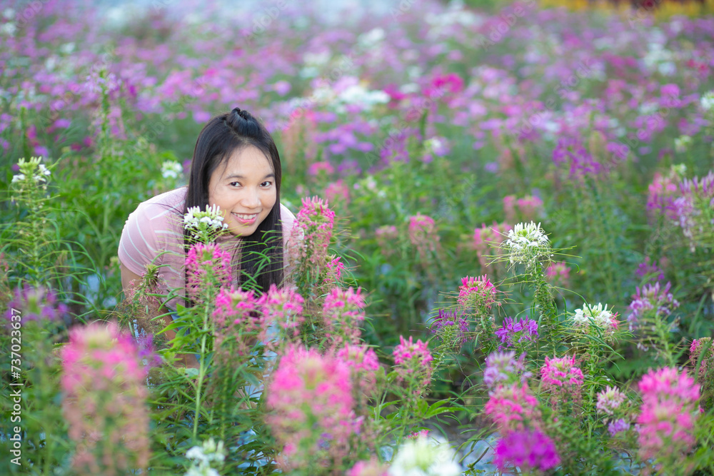 Beautiful asian woman in the flower garden with nature background. Beautiful asian woman in the flower garden with nature background.