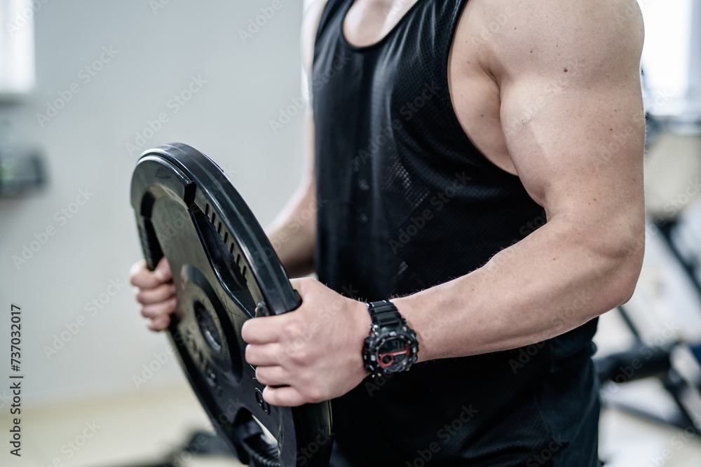 Muscular man is engaged in gym Muscular man is engaged in gym