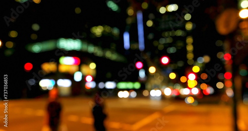Blurred city lights create a vibrant backdrop at night