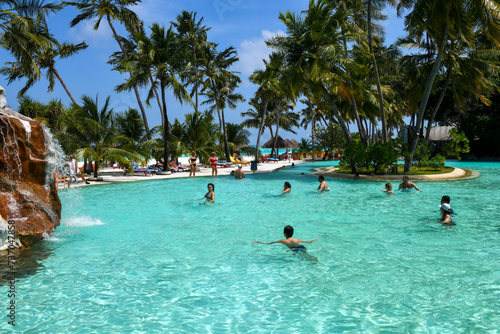 People practicing aqua aerobics at Villa Park resort on Ari atoll in Maldives photo