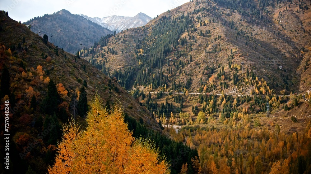 Beautiful autumn landscape of a cable car in the mountains of Almaty on bright day