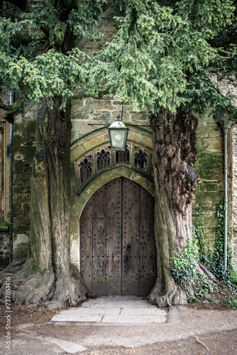 Ancient Roots Embrace St Edward   s Church Entrance  Stow-on-the-Wold