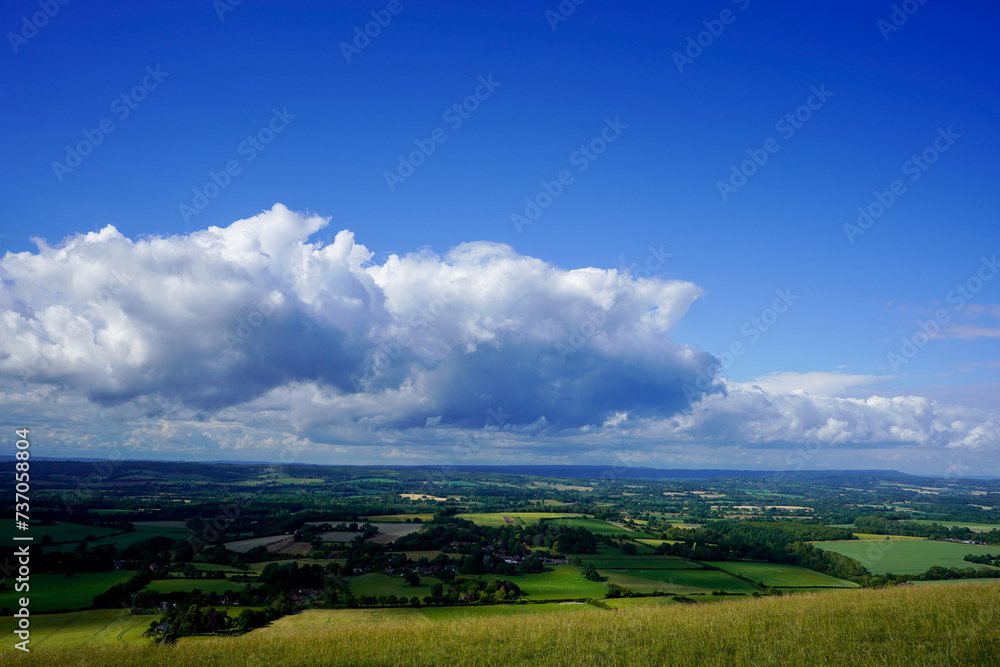 View of farm fields and clouds in the countryside   