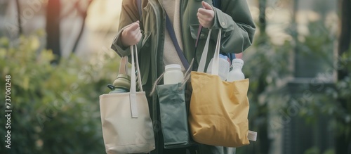 Zero Waste Lifestyle person holding reusable bags and containers, emphasizing the importance of reducing waste and using eco-friendly alternatives.