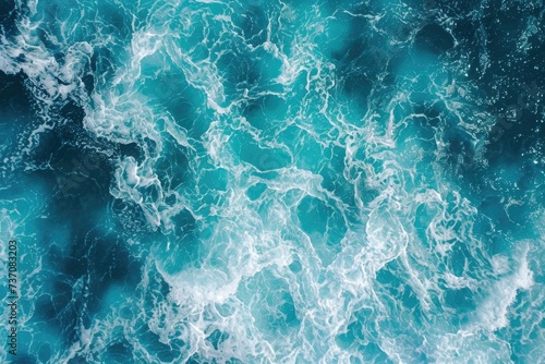 Turquoise ocean waves in aerial view.