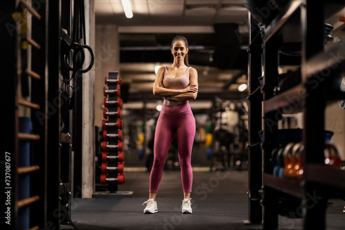 Portrait of a confident sportswoman in a gym looking at the camera. © dusanpetkovic1