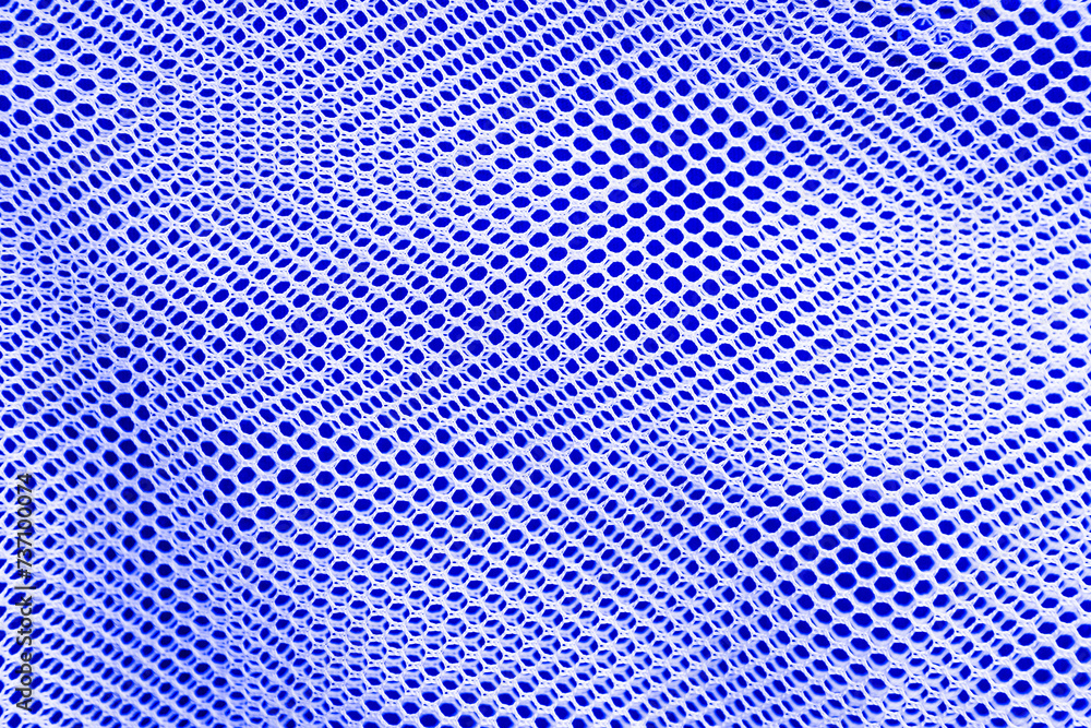 White net on blue fabric background, white net texture background White net on blue fabric background, white net texture background