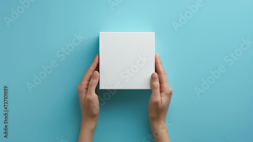 Hands Holding a Blank White Box