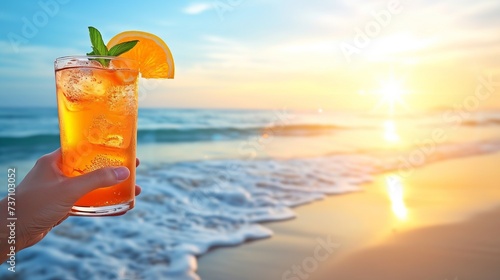 Man enjoying long island iced tea cocktail on tropical beach on hot summer day with copy space