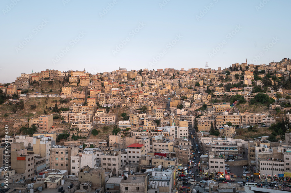 Captivating skyline of Amman, Jordan traditional houses atop a picturesque hill