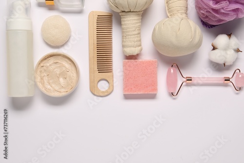 Bath accessories. Flat lay composition with personal care products on white background, space for text