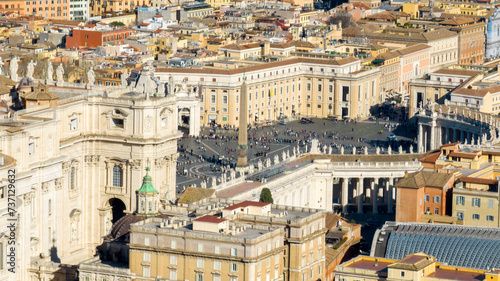 Aerial view of the colonnade and St. Peter's square located in the Vatican city. This state is an enclave within the city of Rome, Italy. The obelisk in the center is known as "The Witness".