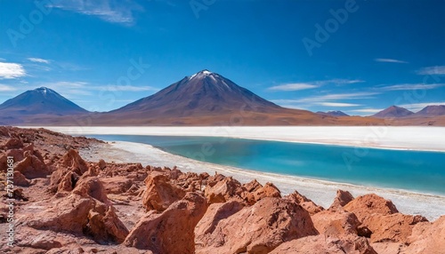 piedras rojas in atacama desert colorful landscapes of a salt flat and the altiplano lakes with black volcanos at the background situated in the heart of the chilean altiplano
