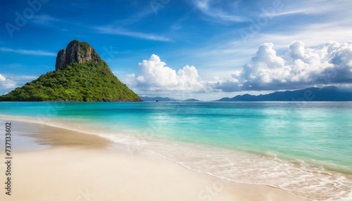 sandy tropical beach with island on background